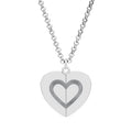 Silver-tone hidden message heart necklace closed with an engraved heart outline